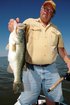 Capt. Steve Niemoeller of Central Florida Guide Service shows off a bass he caught on a SteelShad blade bait while fishing on the Harris Chain of lakes near Mount Dora, Fla.  (Photo by John N. Felsher)