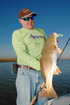 Howard Hammonds, president of Mystic Tackleworks, shows off a redfish he caught on an Attraxx Mystic Shrimp soft bait while fishing with Capt. Phil Robichaux�s Guide Service and in the marshes near Lafitte, La.  (Photo by John N. Felsher)