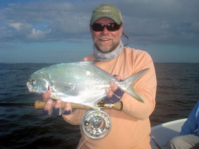 Capt. Rick Grassett with a nice pompano caught and released on a fly in Sarasota Bay.
