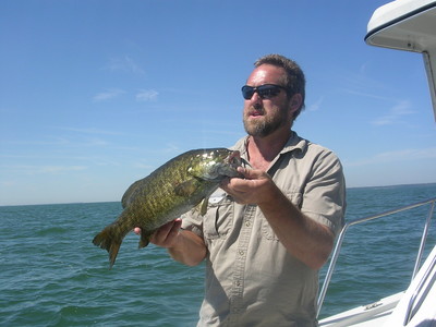 Jim Smith shows off his 20.25 inch Smallmouth Bass caught aboard the Erie Quest, Sept. 1, 2008