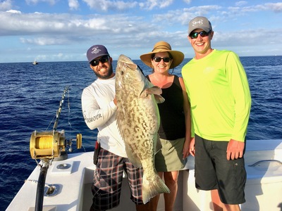 Happy customers with a nice gag grouper