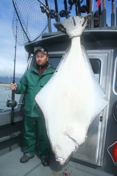 Shane Long of Talmage, Utah, poses with his 215-pound halibut caught June 17 while fishing with Alaskan Anglers Inn in Gustavus, Alaska. Long caught the halibut on a whole salmon carcass fished with a size 20/0 Eagle Claw circle hook. Photo by Andy Martin