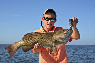 Austin with slot gag grouper caught when he fished with Capt. Woody Gore