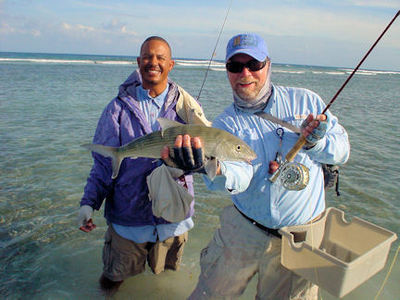 Capt. Rick Grassett and guide, Dubs, with a bonefish caught and released at Turneffe Flats Lodge in Belize.