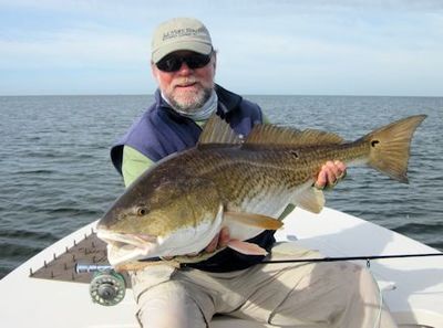 Capt. Rick Grassett with a big Louisiana redfish caught and released on a fly while fishing with Capt. Al Keller out of Hopedale, LA.