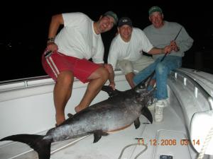 Chalie Mortone and friends with a 200 pound Swordfish.
