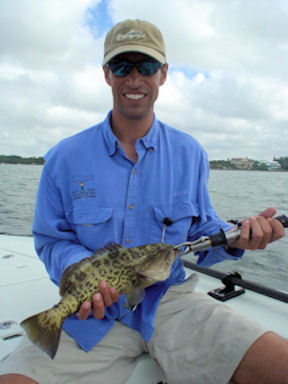Dennis Bolte, from CO, with a gag grouper caught and released with a fly while fishing the flats of Sarasota Bay with Capt. Rick Grassett.