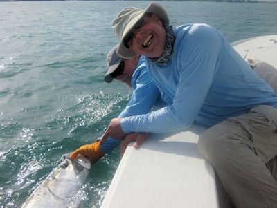 Domenick Raschella, from VA, with a tarpon cuaght and released on a live crab while fishing the coastal gulf in Sarasota with Capt. Rick Grassett.