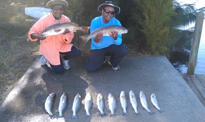 Darius and Dorthy with a limit of reds and trout