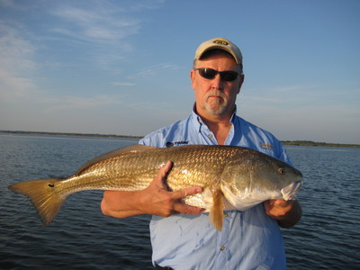 Gary with a nicely sight fished redfish. Mosquito Lagoon Style!