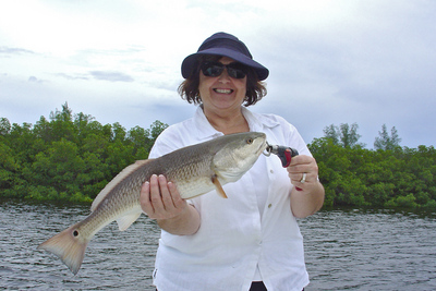 Lori with nice redfish caught around the mangroves.