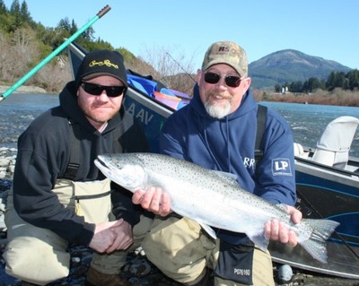 Mike Smith of Salem, Ore., holds a steelhead caught Feb. 17 on the Chetco River with guide Andy Martin of Wild Rivers Fishing. The steelhead hit a small cluster of roe cured in Pautzke's BorxOFire fished with a pink Puff Ball and size 2 Eagle Claw hook.
