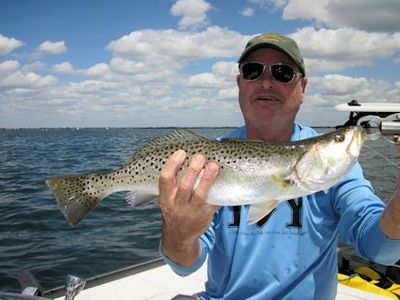 Steve Dornbos, from MI, with a nice trout caught and released on Ultra Hair Clouser flies while fishing Sarasota Bay with Capt. Rick Grassett.