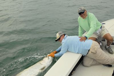 Dennis Ondercin, from OH, with a tarpon caught and released in the coastal gulf in Sarasota while fishing with Capt. Rick Grassett.