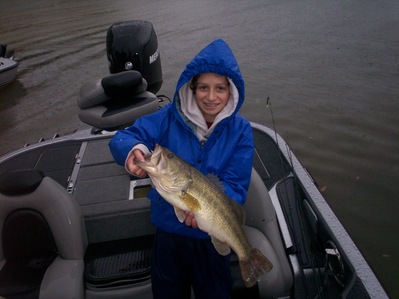 This young lady caught this 7 pound Guntersville lake largemouth bass on a white Scum Frog