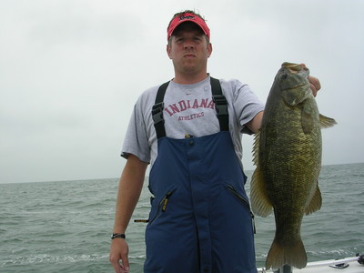 Ryan displays his 6 pound 8 oz. Smallmouth Bass caught with Erie Quest Charters