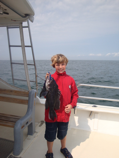 Eic Maest, age 8, with sea bass
