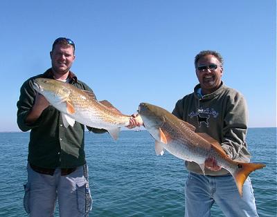 Two big bull red fish caught last November off Pensacola Beach. What are you waiting for book your trip today!