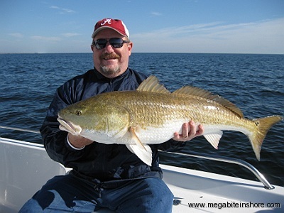 John was all smiles after landing this Monster Redfish.