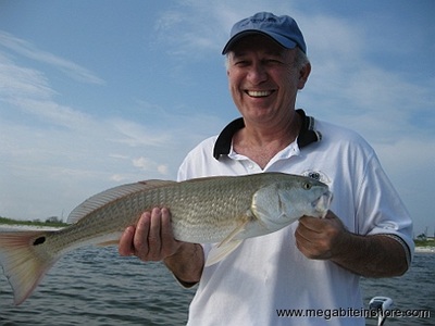 Steve is all smiles after landing this nice slot red