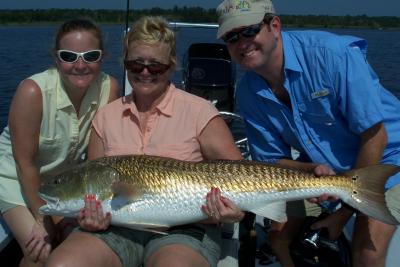 Angela, Peggy and Tom with Peggy's big fish.