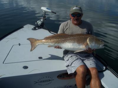 Captain Dave with a top water redfish.