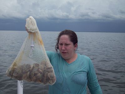 Jessica with a bag of 80 scallops.