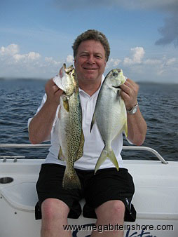 Jim is all smiles after he boated this big trout and a big pompano