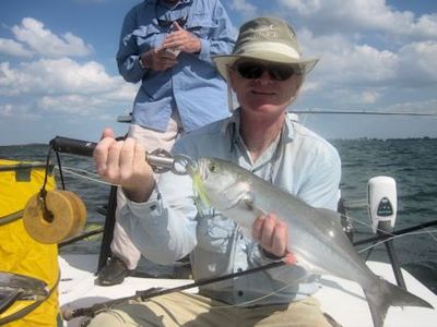 Bill Miller, from MS, with a bluefish caught and released on an Ultra Hair Clouser fly while fishing Sarasota Bay with Capt. Rick Grassett.