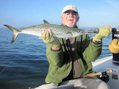 Anna Maria Island winter resident, Bill Morrison, with a big Spanish mackerel caught on an Ultra Hair Clouser fly while fishing Sarasota Bay with Capt. Rick Grassett.