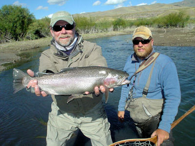 Capt. Rick Grassett with an 8-lb Montana rainbow caught and released on a nymph.