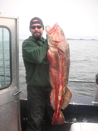 My friend Chris with a giant Ling Cod