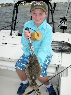 Dougy Boardman, from Richmond, VA. with a flounder caught and released on a CAL jig with a live shrimp while fishing Sarasota Bay with Capt. Rick Grassett.