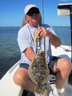 Ed Nordgren, from Ft. Myers, FL, with a nice flounder caught in a shallow water pothole on a CAL jig with a shad tail while fishing Sarasota Bay with Capt. Rick Grassett.