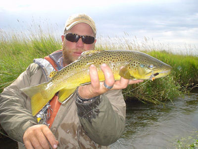 Guide Dave King witrh a nice Montana spring creek trout caught on a hopper fly.
