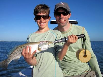 Orvis social media manager, Tucker Kimball, and his son Harrison, from VT, with a nice trout caught and released on an Ultra Hair Clouser fly while fishing Sarasota  Bay with Capt. Rick Grassett.