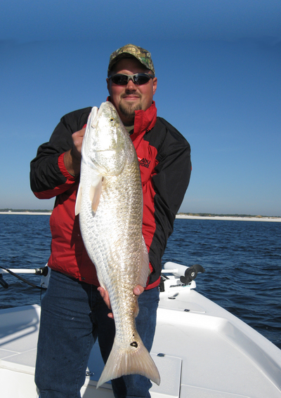 Blake holds the biggest redfish of the day,,Way to go Blake