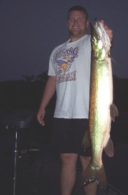 Jim Dahlgren shows off a nice musky, his first legal, caught while fishing with Wausau area guide Joel DeBoer