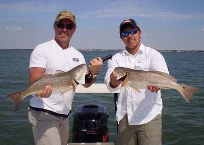 Ron and Hayden with their redfish.