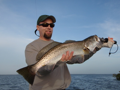 Doug with a nice 9 plus pound trout on top water.