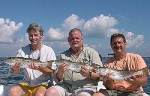 Rip, John, and Kerry show off three nice slot Redfish.