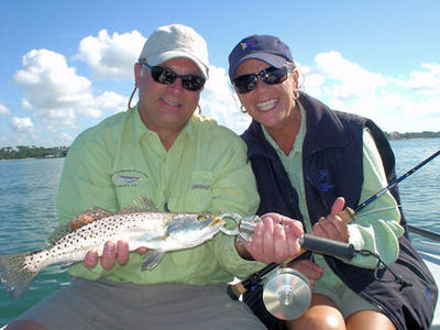 Brian and Joanne shenstone, from MI, with a trout caught and released on an Ultra Hair Clouser fly while fishing Sarasota Bay with Capt. Rick Grassett.