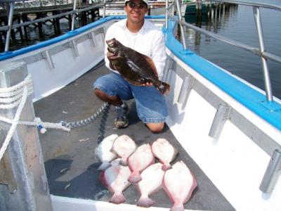 Edwin Arias, Rosell, N.J. with his limit catch of Fluke.