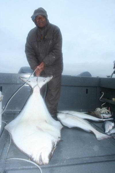 Major Clay of Washington with a 150-pound halibut.