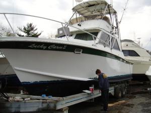 Audrey touching up boot stripe