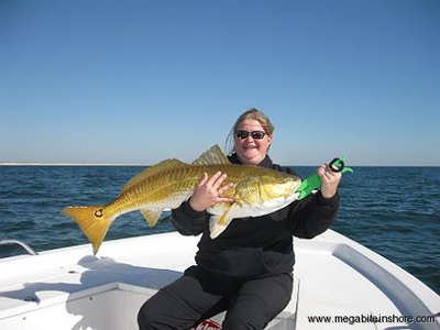 April shows off her first redfish