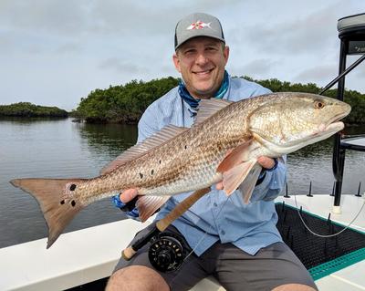 Chap Dinkins showing off his first ever landed Redfish on fly.